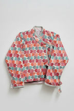 Floral patterned jacket on a light gray background